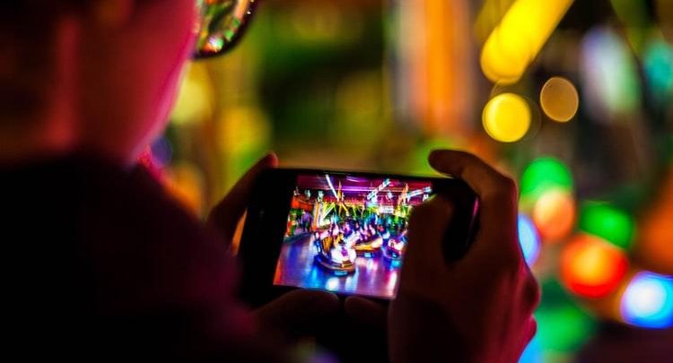 Boy watching a video on his mobile