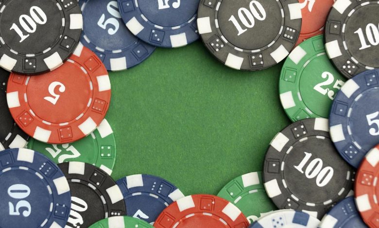 casino-tokens-on-green-background-with-blank-space-free-photo