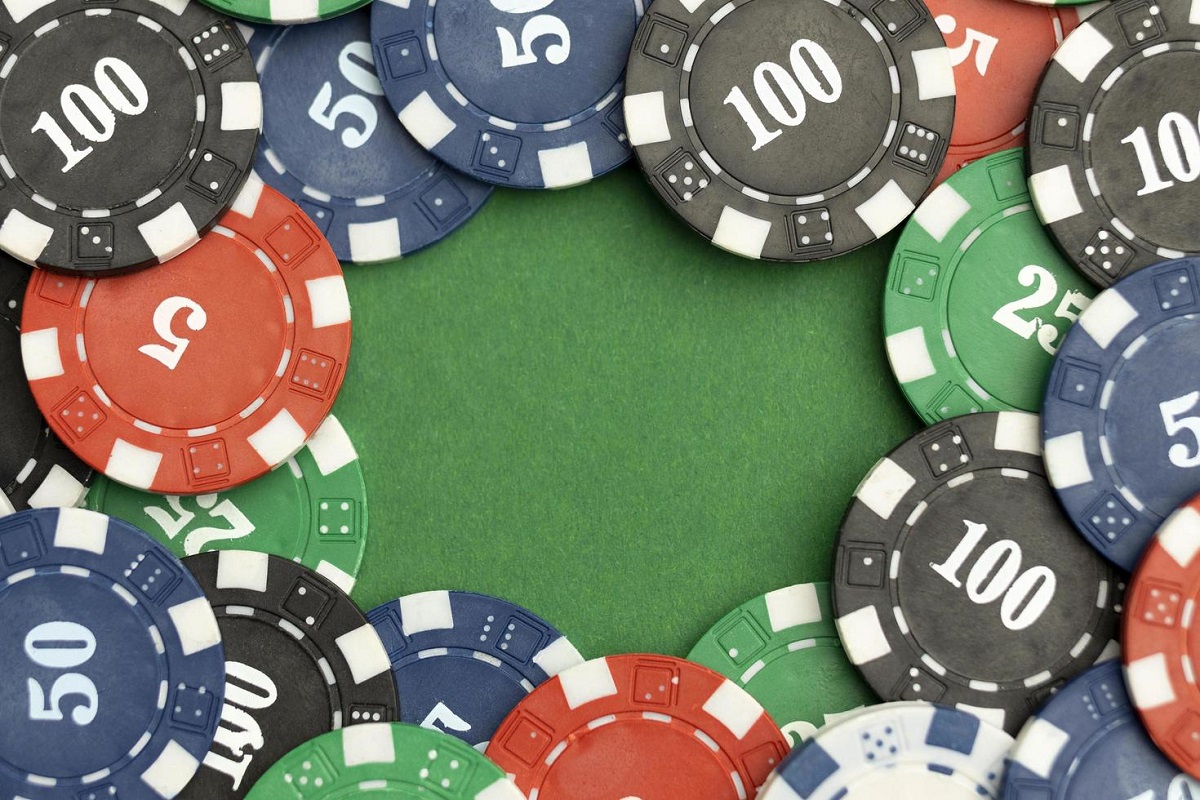 casino-tokens-on-green-background-with-blank-space-free-photo