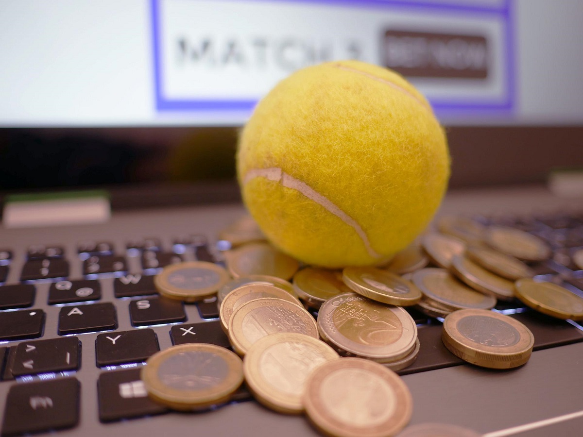 laptop and coins