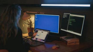 Women using desktop and laptop