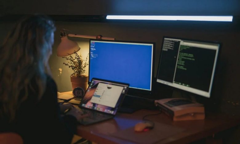 Women using desktop and laptop