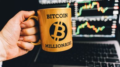 bitcoin cup with laptop