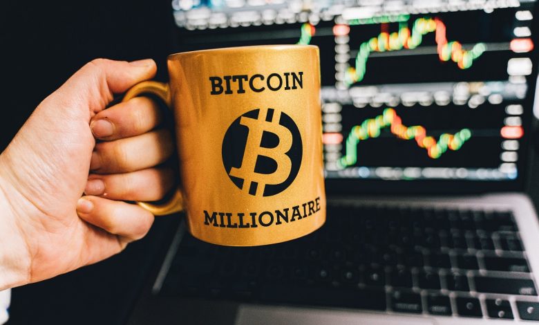 bitcoin cup with laptop