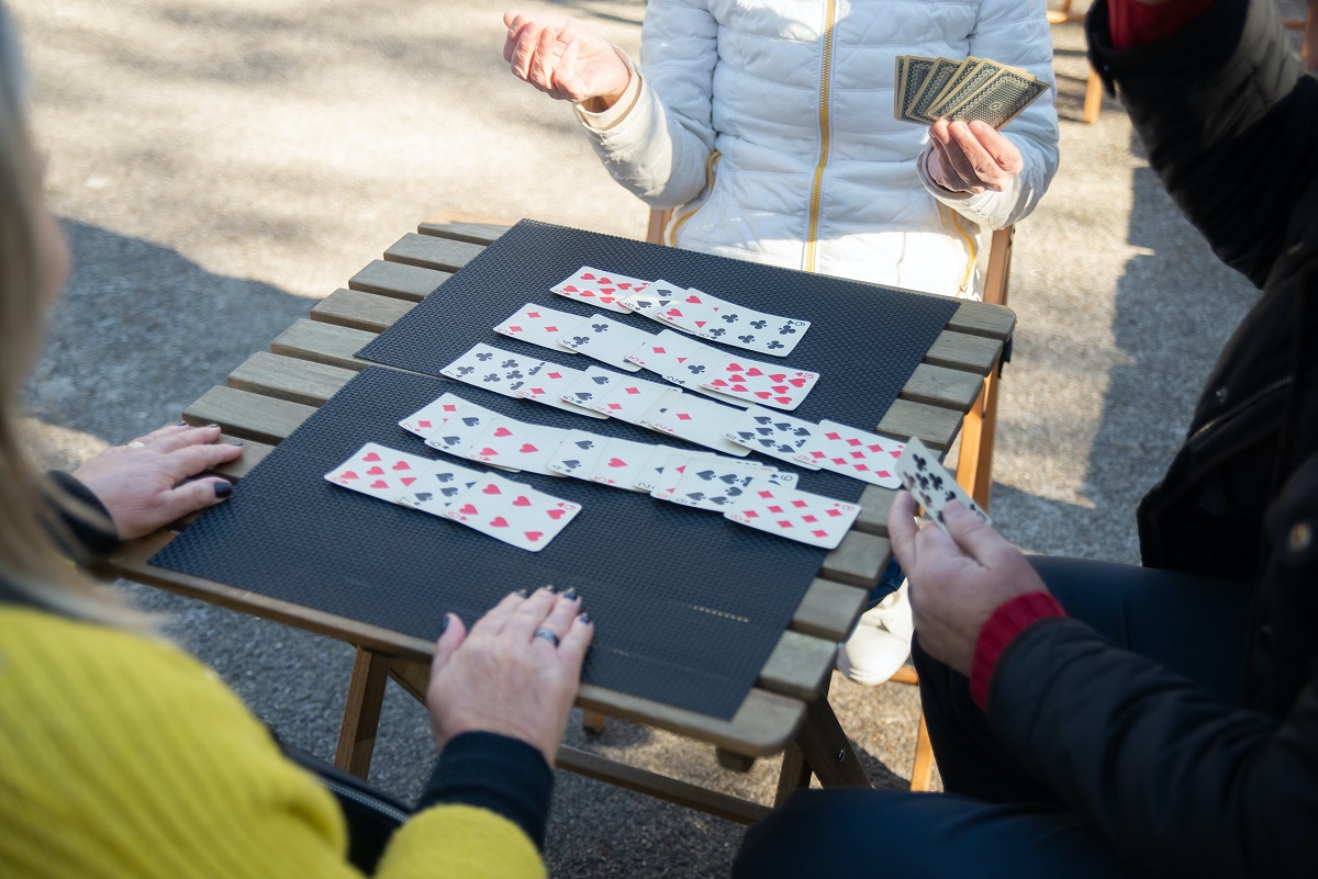 Group of People Playing Solitaire